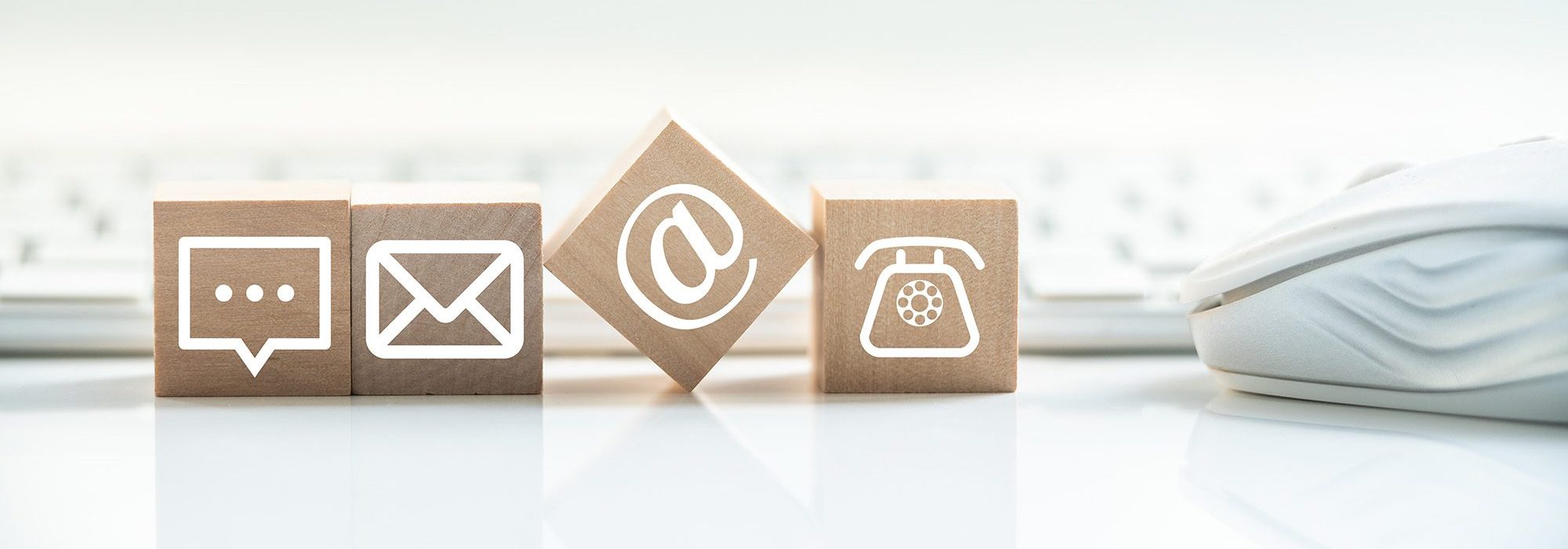 close up of wooden bricks with contact icons