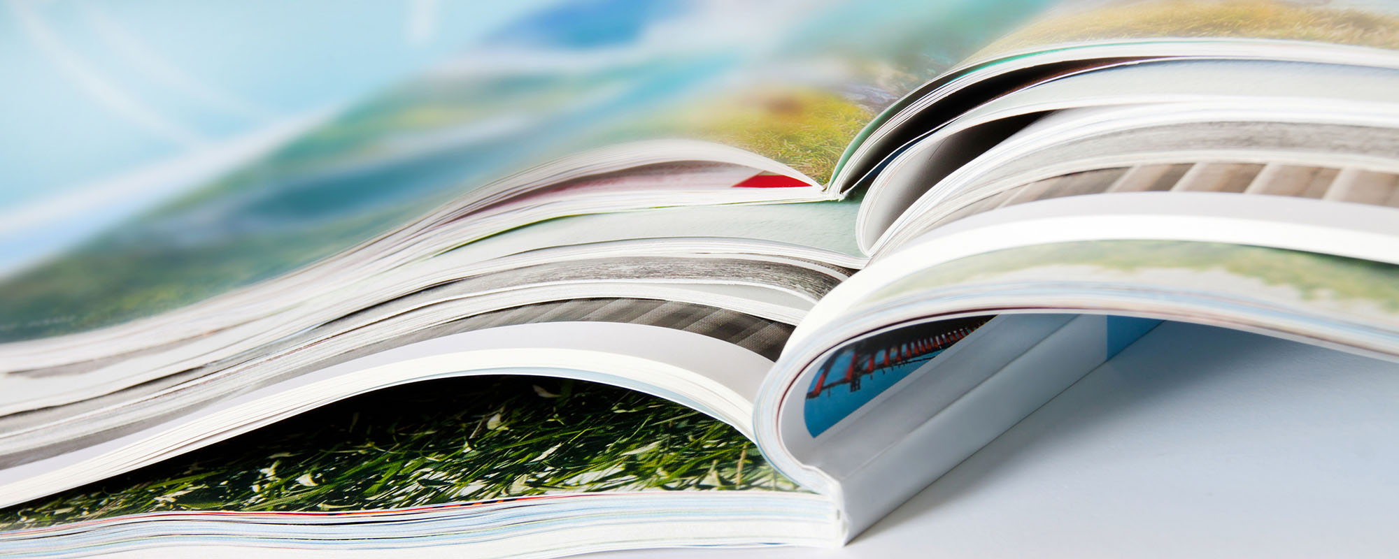 close up of open colorful magazines